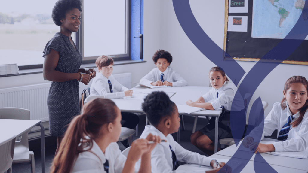 Mixed race female teacher with a class of teenagers in school uniform